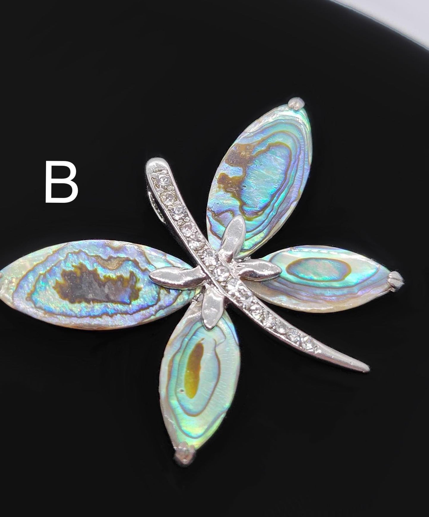 Dragonfly paua shell pendants.