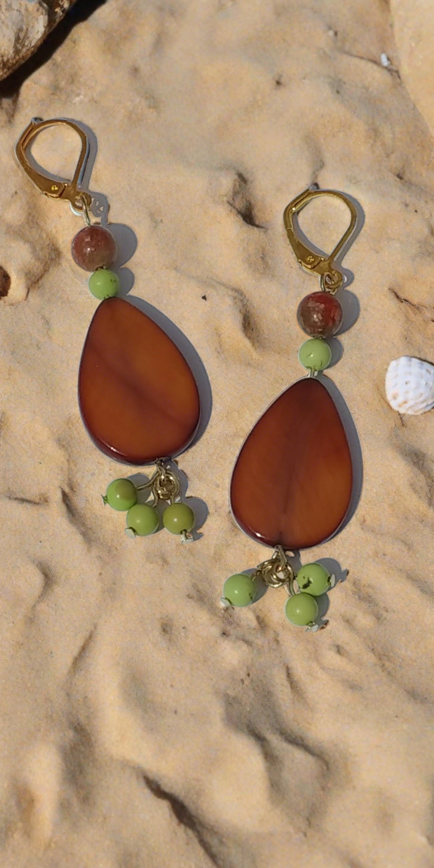 Our brown shell earrings with green accent beads.