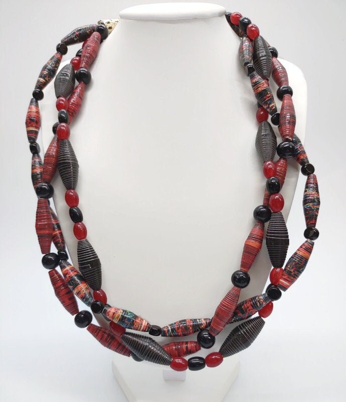 Three strand red paper beaded necklace.