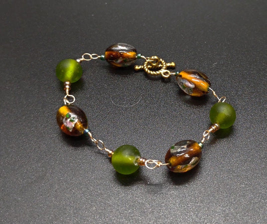 Brown and green glass beaded bracelet.