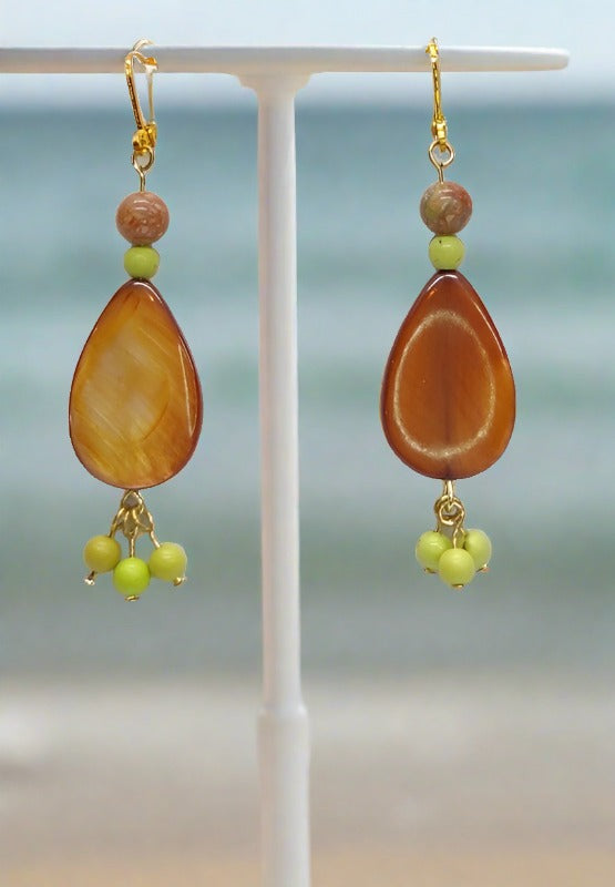 Our brown shell earing with green accent beads. 
