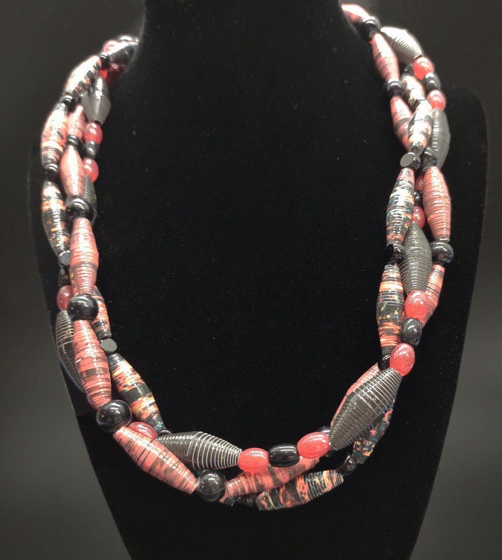 Three strand red paper beaded necklace.